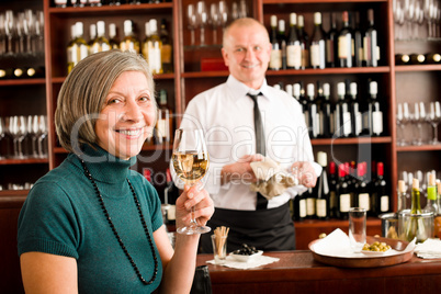 Wine bar senior woman enjoy wine glass