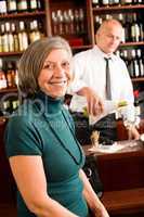 Wine bar senior woman enjoy wine glass