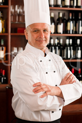 Chef cook confident professional posing restaurant