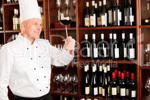 Chef cook hold wine glass in restaurant