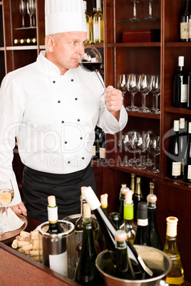 Chef cook taste wine glass in restaurant
