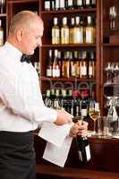 Wine bar waiter opening bottle restaurant