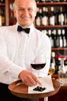 Wine bar waiter mature serve glass restaurant