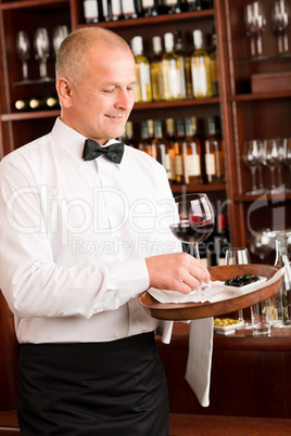 Wine bar waiter mature serve glass restaurant