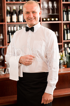 Wine bar waiter mature smiling in restaurant
