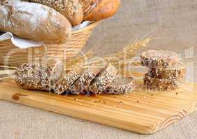 Diverse bread with slices of bread with grains