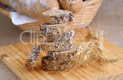 A stack of slices of bread with grains