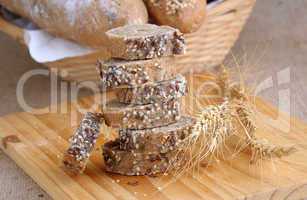 A stack of slices of bread with grains