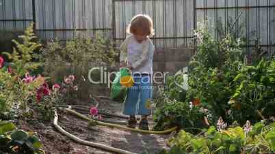 A boy and a watering can