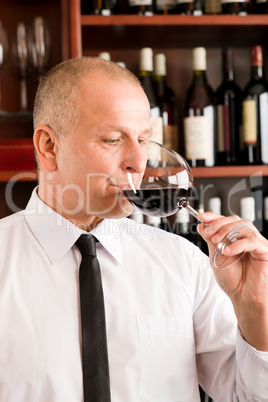 Bar waiter taste glass red wine restaurant