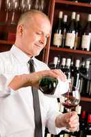 Wine bar waiter pour glass in restaurant