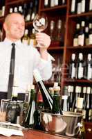 Wine bar waiter clean glass in restaurant