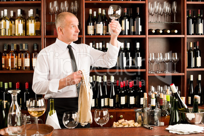 Wine bar waiter clean glass in restaurant