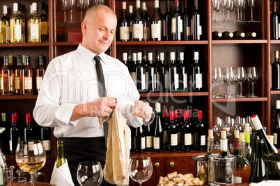 Wine bar waiter clean glass in restaurant