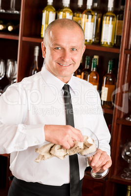 Wine bar waiter clean glass in restaurant