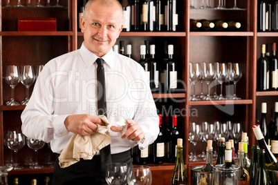 Wine bar waiter clean glass in restaurant