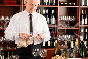 Wine bar waiter clean glass in restaurant