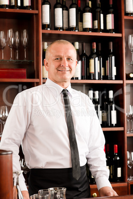 Wine bar waiter happy male in restaurant