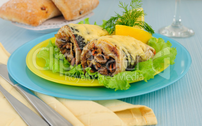 Herring baked with mushrooms and cheese