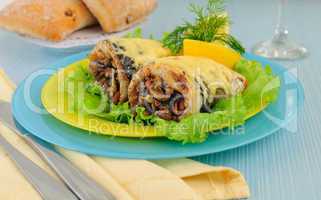 Herring baked with mushrooms and cheese