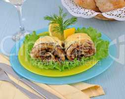Herring stuffed and baked with mushrooms and cheese