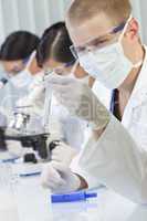 Male Scientist or Doctor With Test Tube In Laboratory