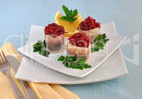 Rolls of herring with beetroot, apple stuffing
