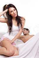 Distraught Young Woman On Bed