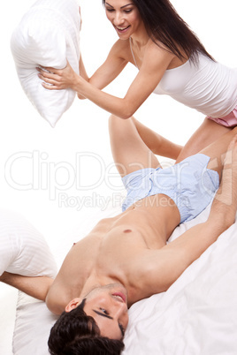 Playful Couple Pillow Fighting