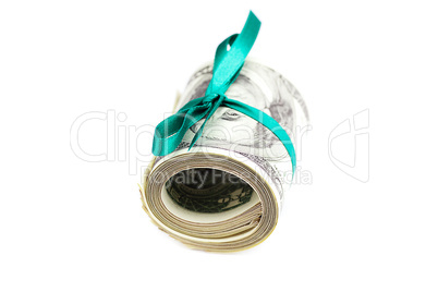 Dollars rolled into a tube tied with ribbon isolated on white