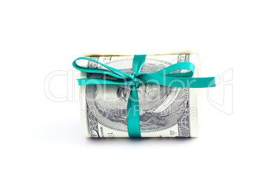 Dollars rolled into a tube tied with ribbon isolated on white