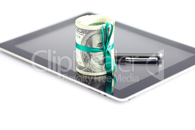 tablet,tube of dollars and stylus isolated on white
