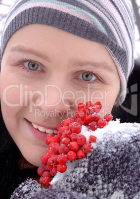 Russian girl with mountain ash berries