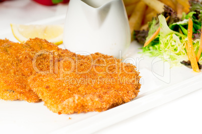 classic Milanese veal cutlets and vegetables