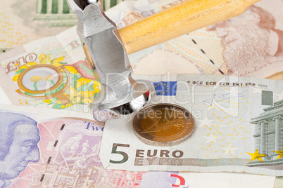 Hammer on top of Euro note