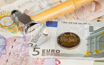 Hammer on top of Euro note