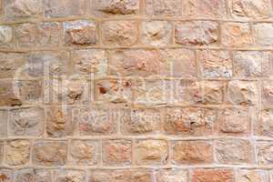 Wall built of rough stone blocks