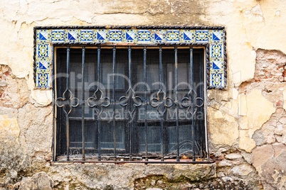 Window of old house in Andalusia with Moorish style tiles