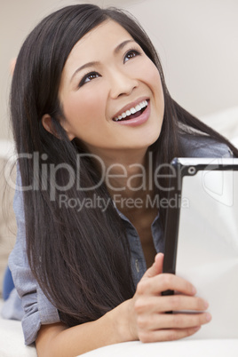 Beautiful Asian Chinese Woman Using Tablet Computer