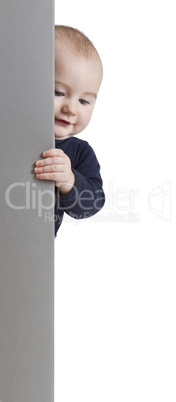 young child holding vertical sign