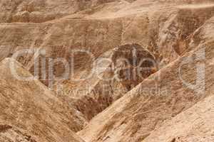 Textured orange hills in the desert