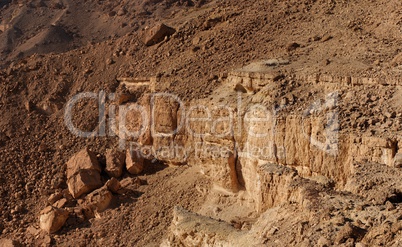 Weathered cracked wall of desert canyon