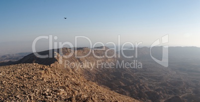 Rim of desert canyon at sunset in the Small Crater (Makhtesh Katan) in Israel's Negev desert