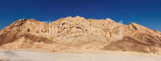 Scenic weathered yellow rock in stone desert