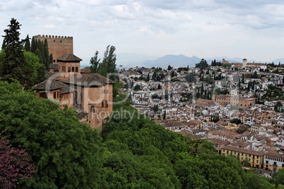 Bastions of Alhambra castle on the hill above the town of Granada, Spain