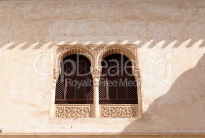 Arched window in Alhambra palace in Granada, Spain