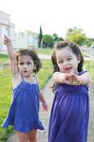 Beautiful little girls enjoying outside