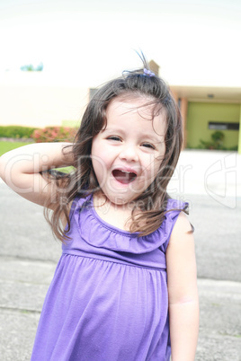 surprised beautiful little girl, summer park in background.