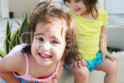 Sweet little girls in front of her little house for playtime (fo