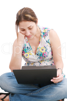 Young girl on the laptop having some problems .